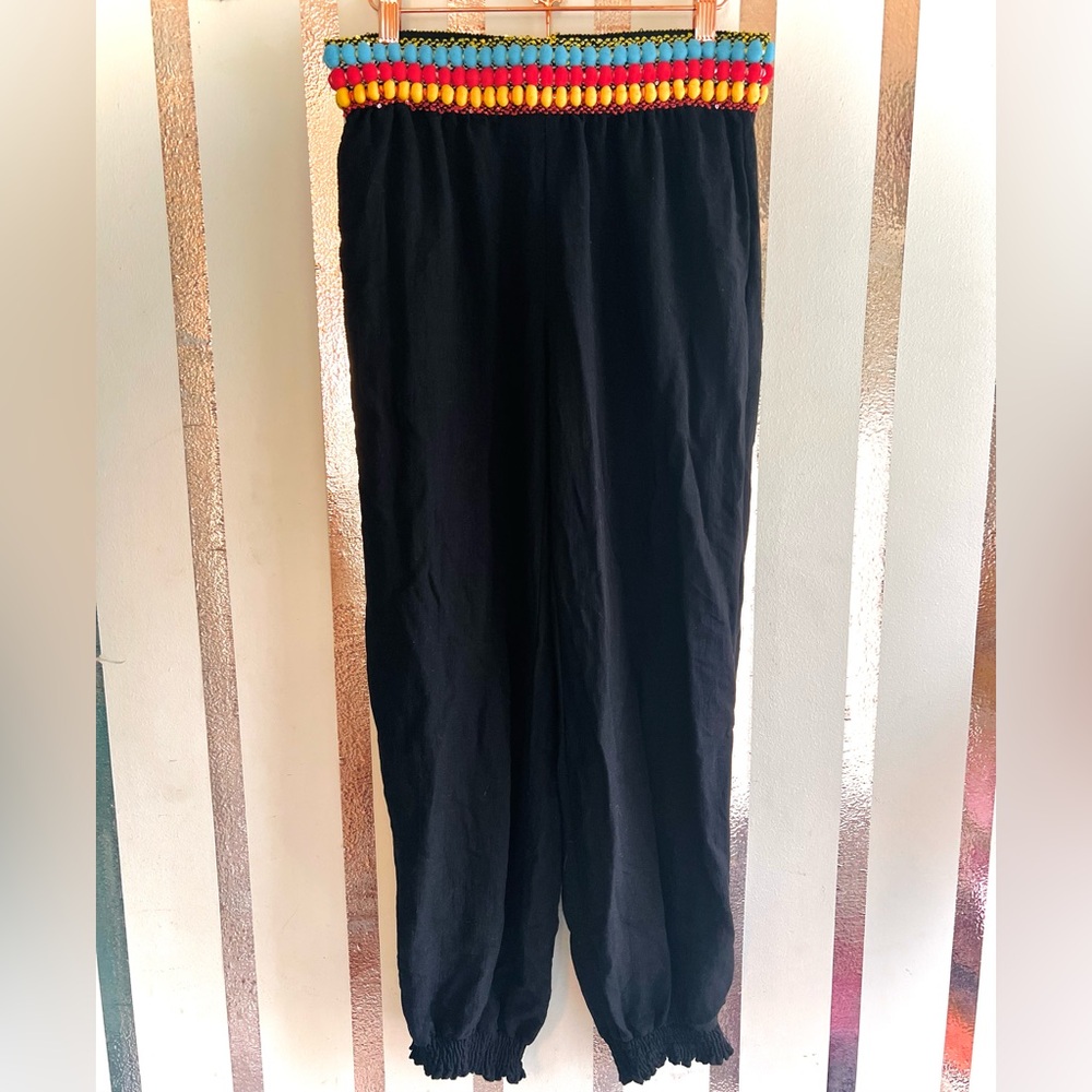 Black Pants With Colorful Pom Poms